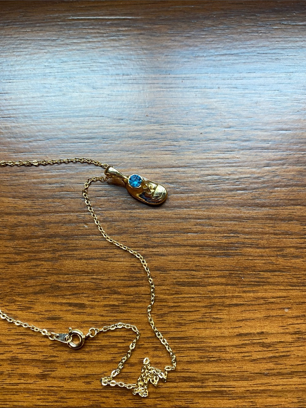 Vintage  birthstone baby shoe. Gold Flip Flop Pendant Necklace with Blue Stone